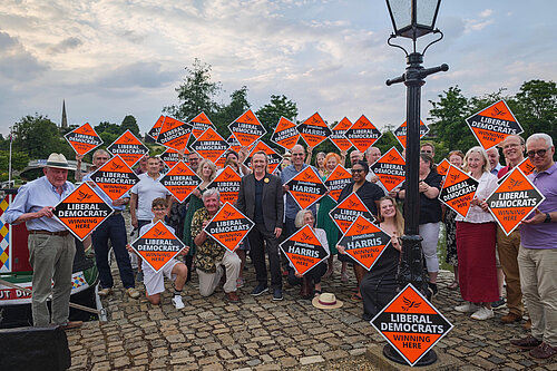 West Northamptonshire Liberal Democrats group photo, holding up Liberal Democrat diamonds