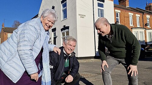 West Northamptonshire Lib Dems, standing next to a large pothole